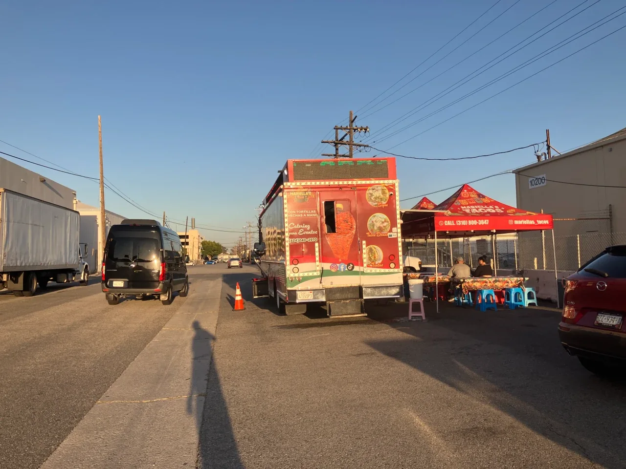 Mariella's Tacos truck parked on an industrial street in the LAX air cargo district