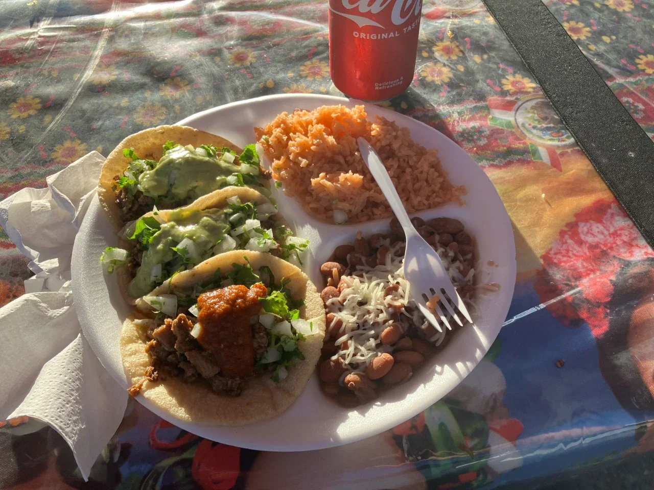 Three tacos with rice and beans from Mariella's Tacos